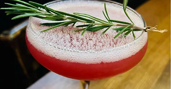 Drink from event with rosemary on top